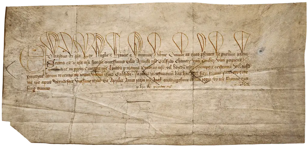 A wide yellowed sheet with five lines of Medieval Latin written in brown ink.