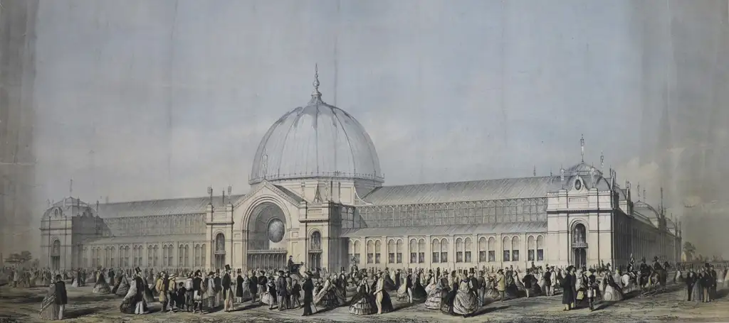 Hundred of people standing outside a large Victorian exhibition building with a glass dome.