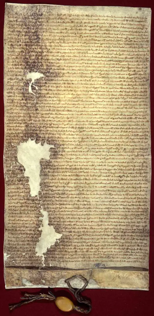 A lengthy, yellowed document with several holes in.