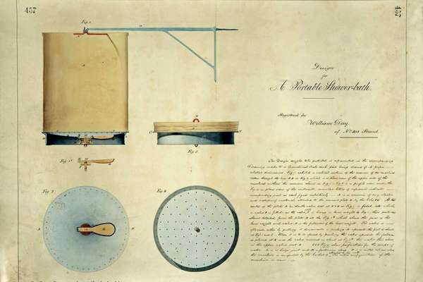 View of a device with a sheet that hangs from a hook above a round base with holes in.