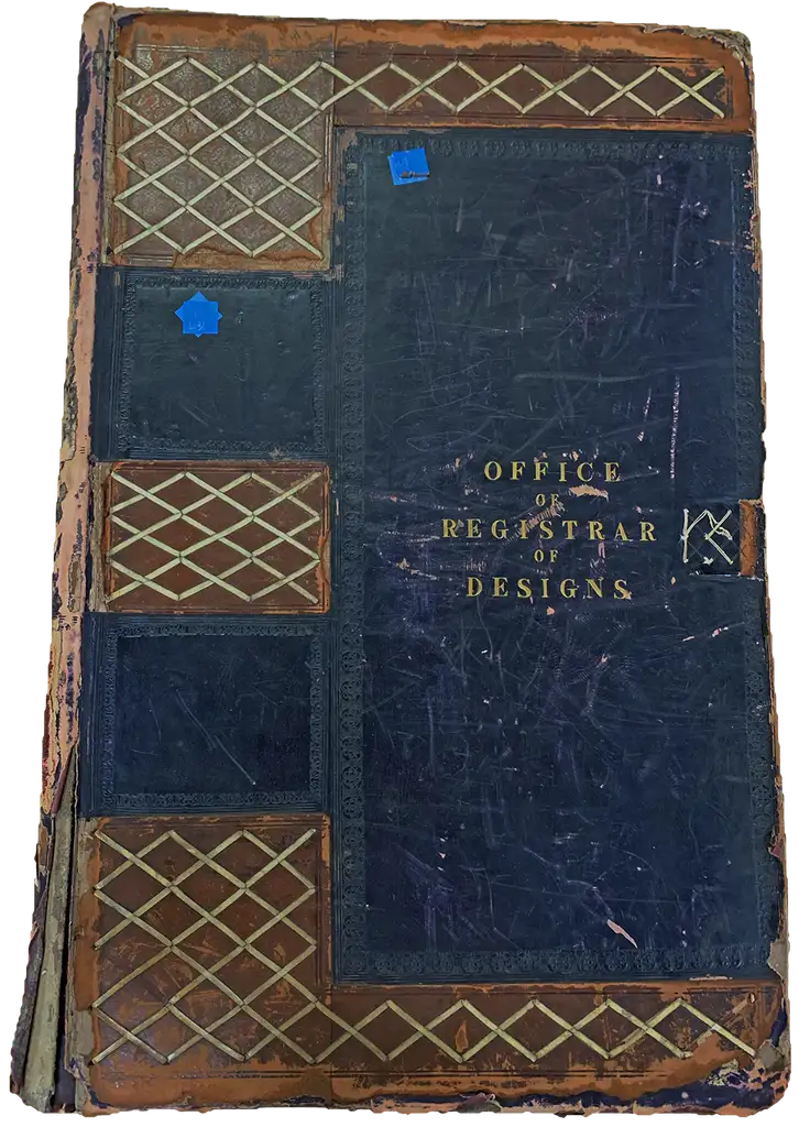 The cover of a blue book, titled Office of Registrar of Designs.