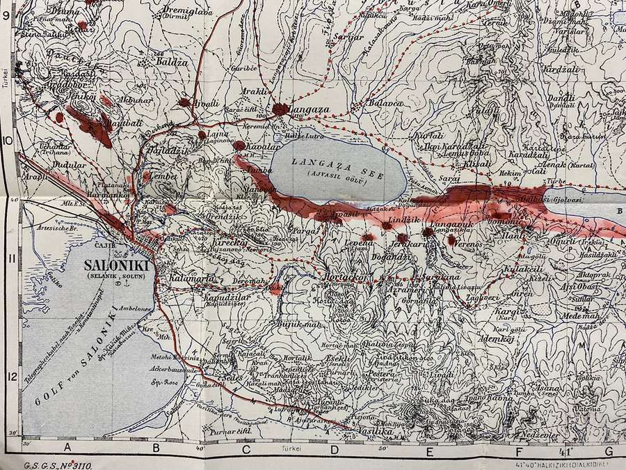 Map showing cities and contour lines around Salonika, with a thick red line at the centre and spots.