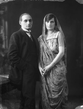 Photograph of a South Asian man wearing a suit and a white woman in traditional South Asian dress