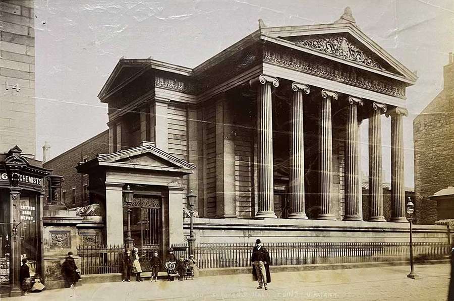 An imposing stone building with columns.