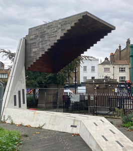 The memorial: an upturned stairway standing in front of the street.