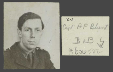 Portrait photograph of a man in military uniform with a slightly melancholy expression.