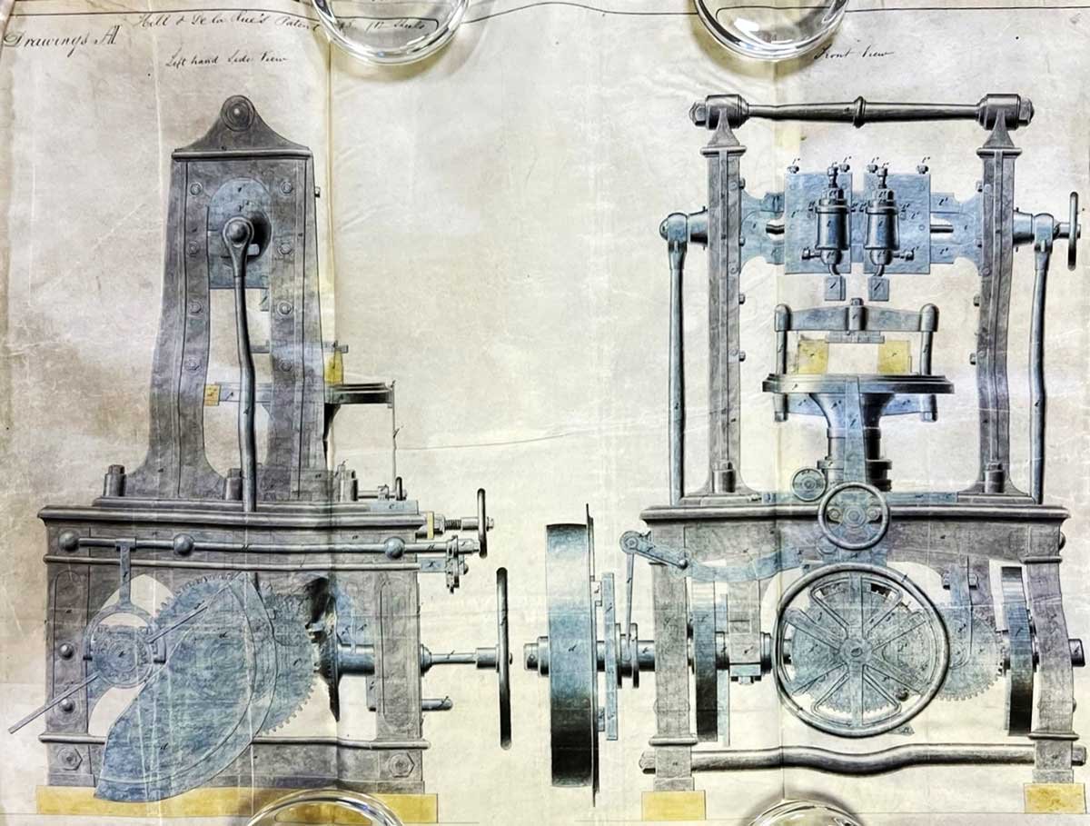 A drawing of two large pieces of metal machinery next to one another, with many frames and gears.