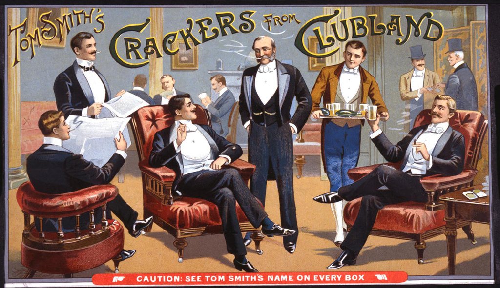 A waiter serves five well-dressed men in a gentleman's club.