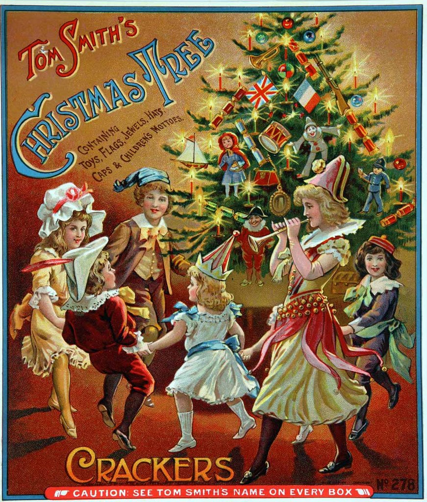 Six children of differing ages dance around a Christmas tree.