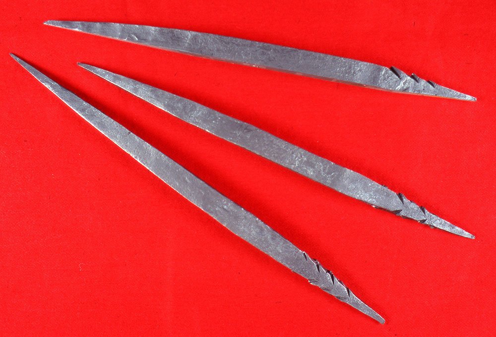 Three long, pointed pieces of metal.