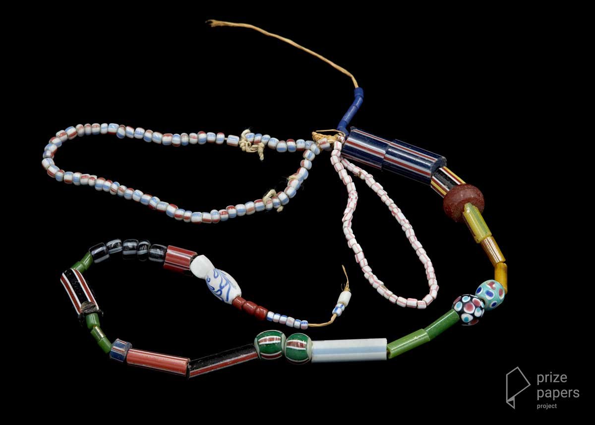 A few dozen colourful beads, of different shapes and sizes, on a length of string.