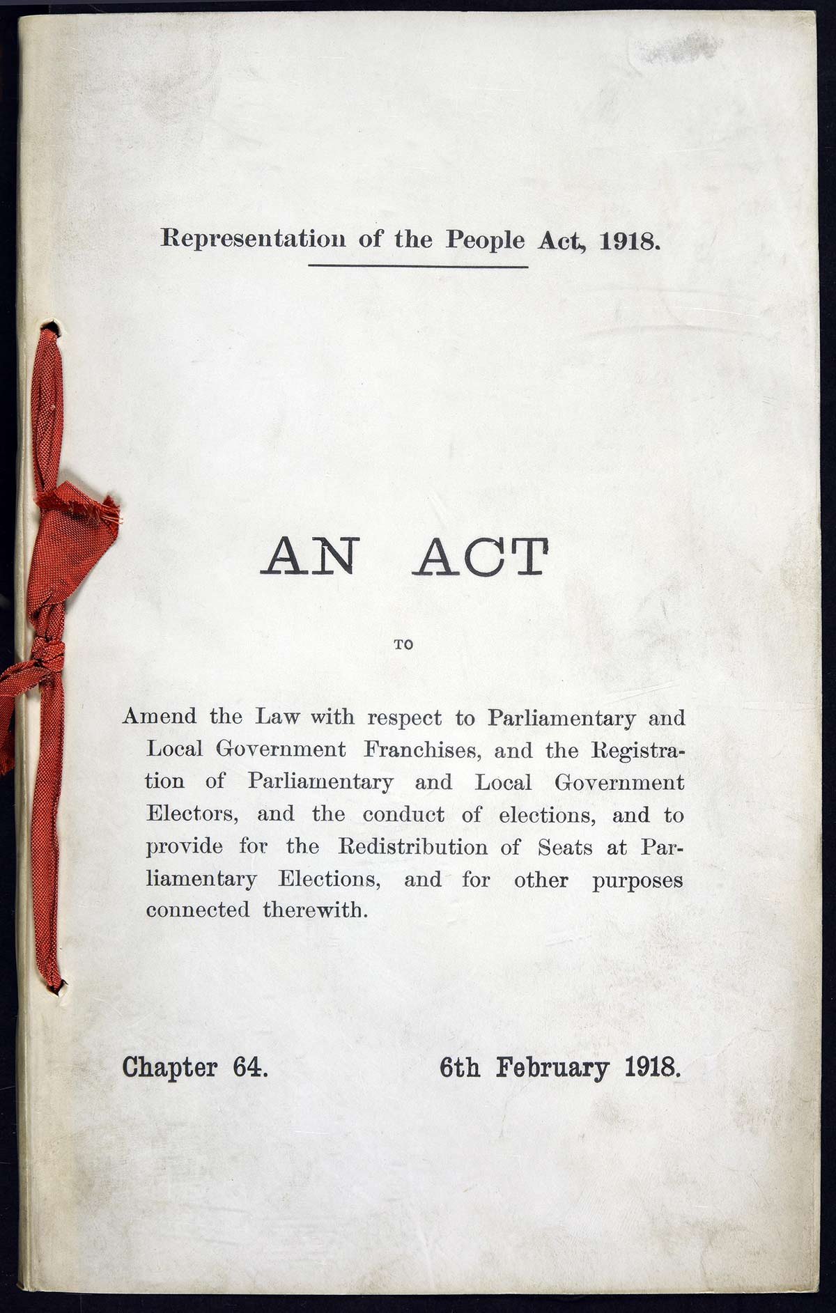 A front cover for 'An Act' document with red binding.