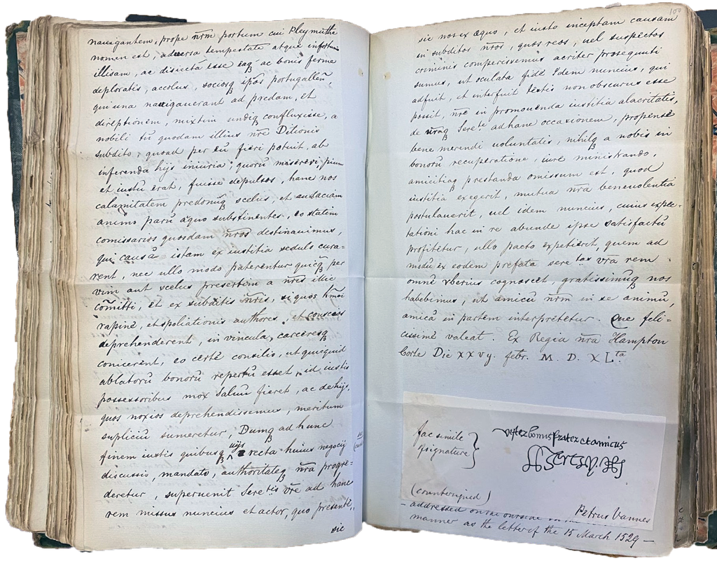 An sizeable notebook opened towards the middle where there is handwritten text.