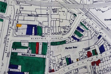 Map showing four connected streets with around a third of buildings coloured in to show damage.