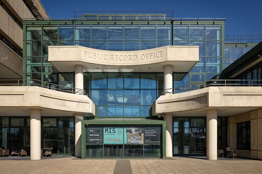 View of the outside of The National Archives' building, featuring modern glass and 60s brutalism.