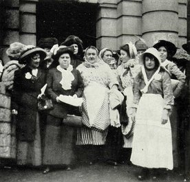 Photograph of a group of women standing in the doorway of a building