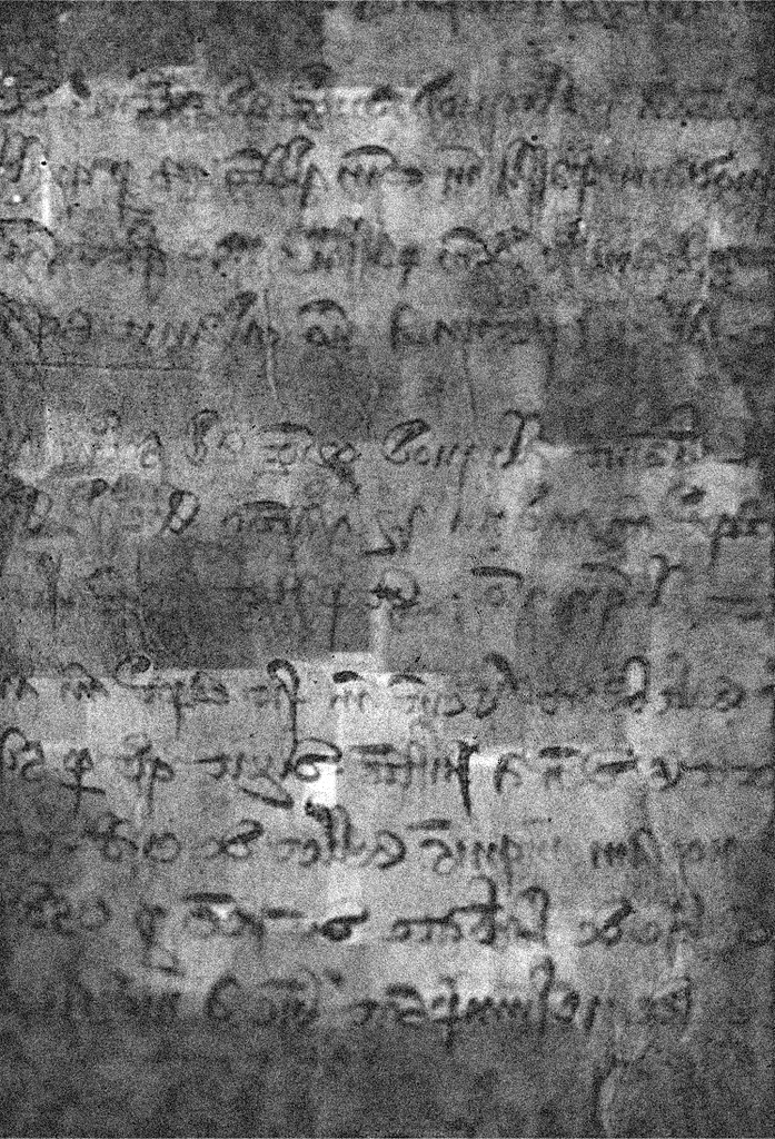 A scanned roll exposing writing, which is black and white after being scanned.