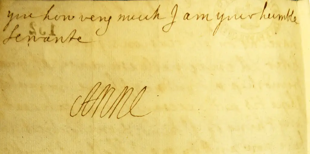 A short handwritten sentence, the end of a letter written on the other side, signed by 'Anne'