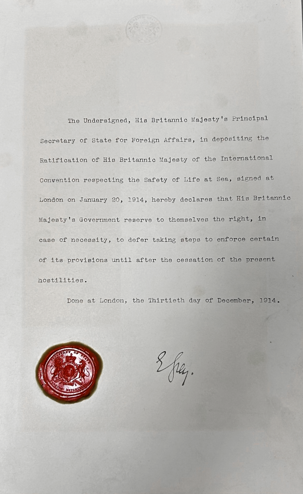 Handwritten signature saying 'E Grey' and red wax seal on a printed page of the document.