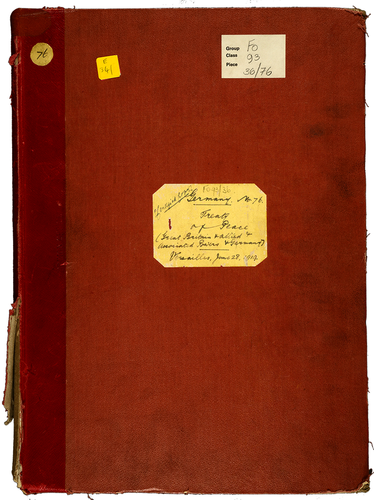 The front cover of the treaty of Versailles. The cover is red and has a handwritten label on front.